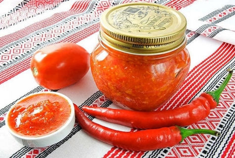 spicy Abkhazian adjika in a jar on the table