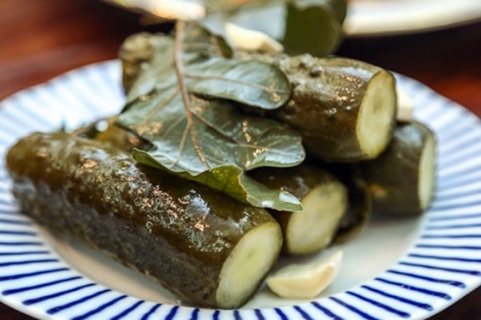cucumbers with oak leaves in a plate
