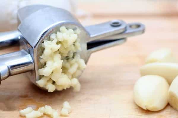 crush the garlic through a press